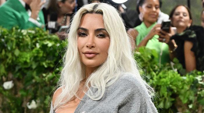 Kim Kardashian Reveals She's Actually Icing Her Back in Seductive Selfie: See Her Leather Look